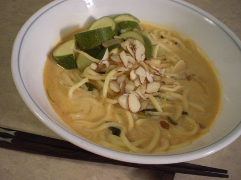 Coconut Thai (red) curry soup with noodles and zucchini.