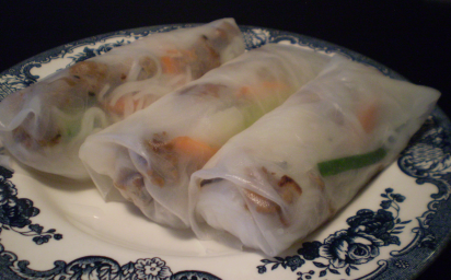 Freshly made salad rolls with chicken, basil, carrots and cucumbers.