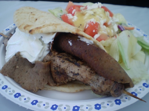Combination plate consisting of pork souvlaki, gyros, dolmades, pita bread and greek salad, $15.